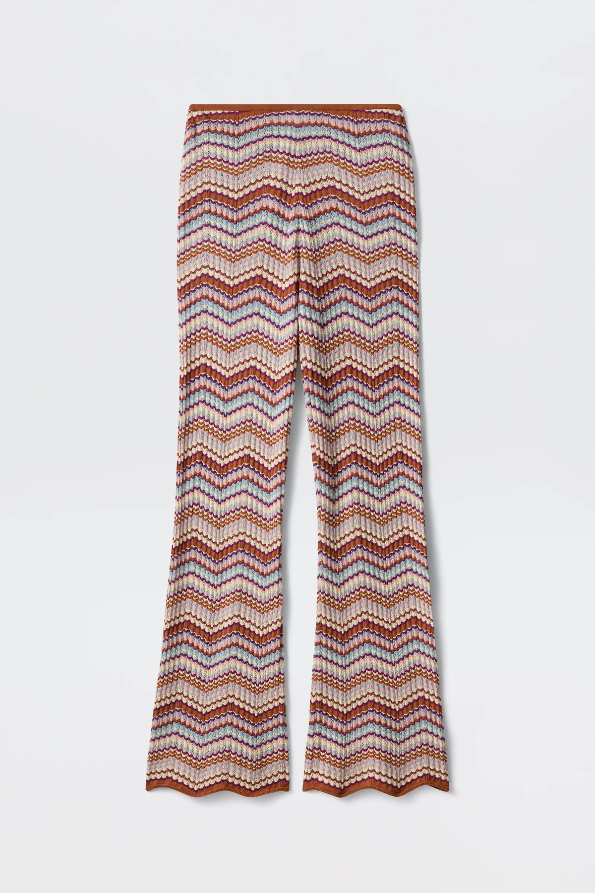 Boni - Maria Chevron Multi pants showcase a vibrant chevron zigzag pattern in orange, pink, and white hues. Crafted from breathable cotton knit, these flared-leg trousers feature a scalloped hem at the bottom, making them a versatile wardrobe essential.