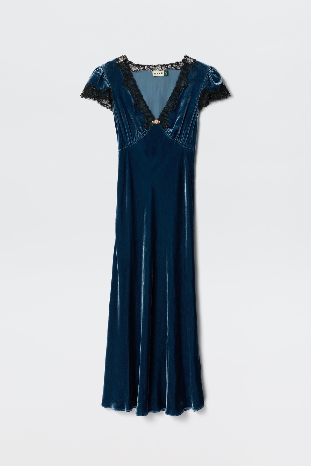 The Clarice - Steel Blue dress features blue velvet fabric, short sleeves, a V-neckline with black lace trim, and a fitted waist. Displayed against a plain white background.