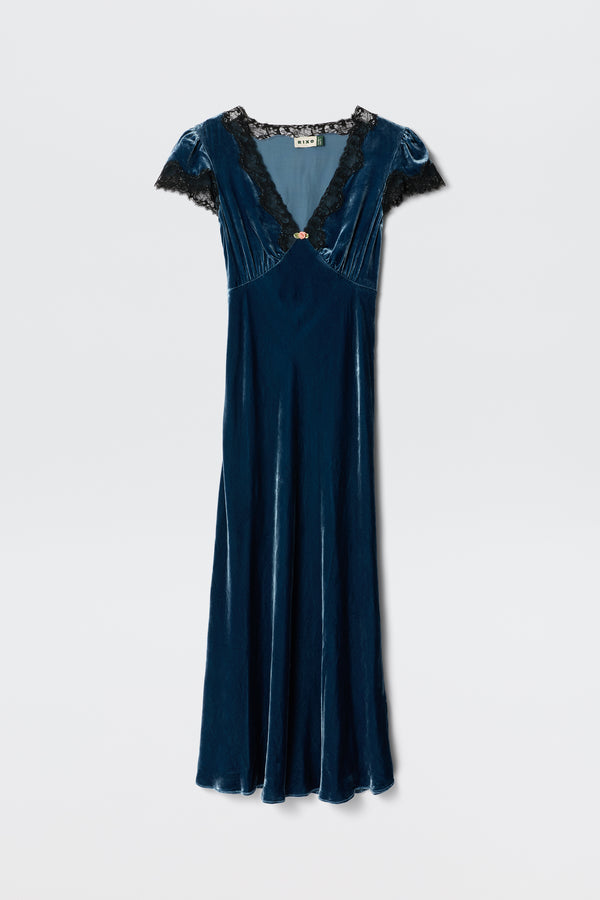 The Clarice - Steel Blue dress features blue velvet fabric, short sleeves, a V-neckline with black lace trim, and a fitted waist. Displayed against a plain white background.