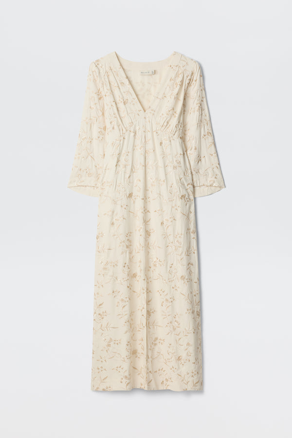 Dahlia - Botanical Embroidery Pearl: A long, cream-colored vintage-inspired dress featuring a subtle embroidered floral design, V-neckline, and long sleeves, displayed against a plain white background.