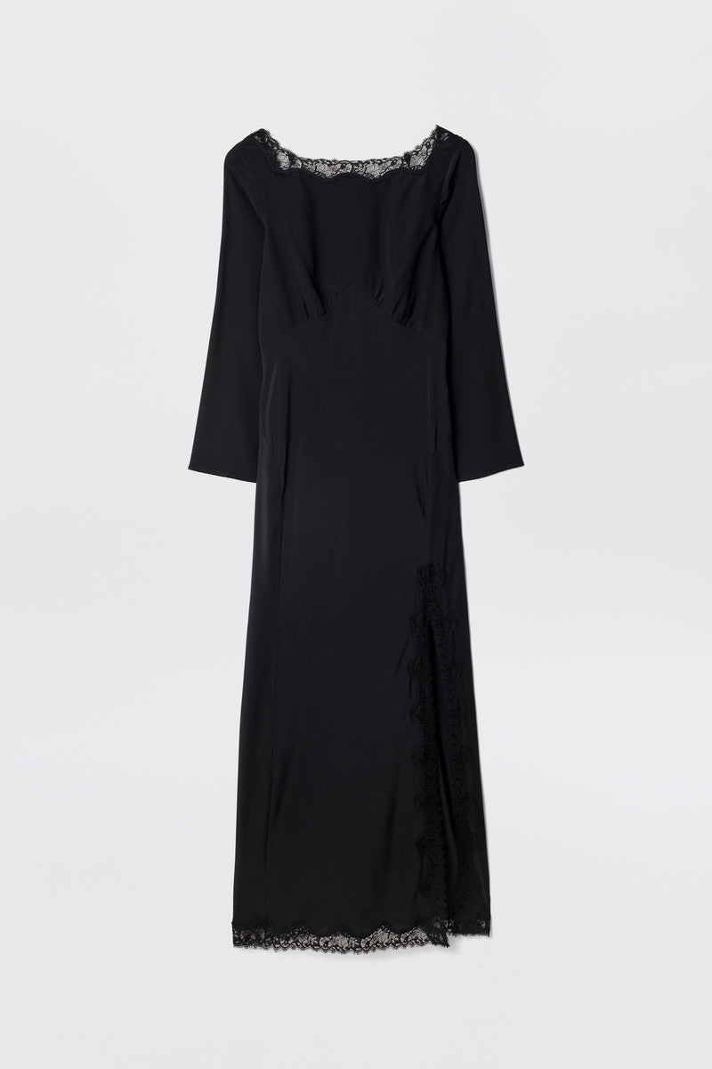 The Mirena - Black is a long black dress featuring long sleeves, a scoop neckline, and delicate lace trim along the neckline, hem, and side slit. Displayed against a plain white background.