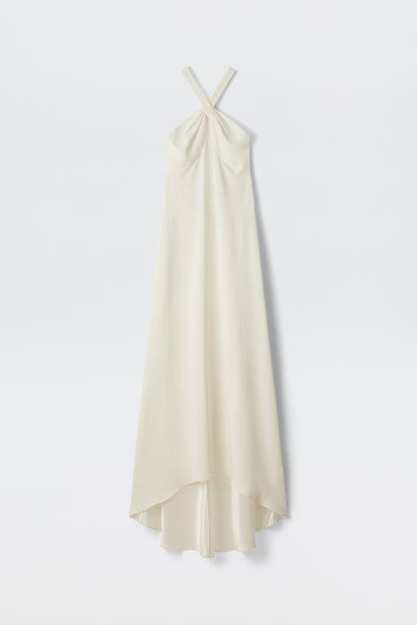 The Giorgia - Ivory is a long, sleeveless bridal gown in satin back crepe with a twist neck halter and high-low hem, shown against a plain white background.