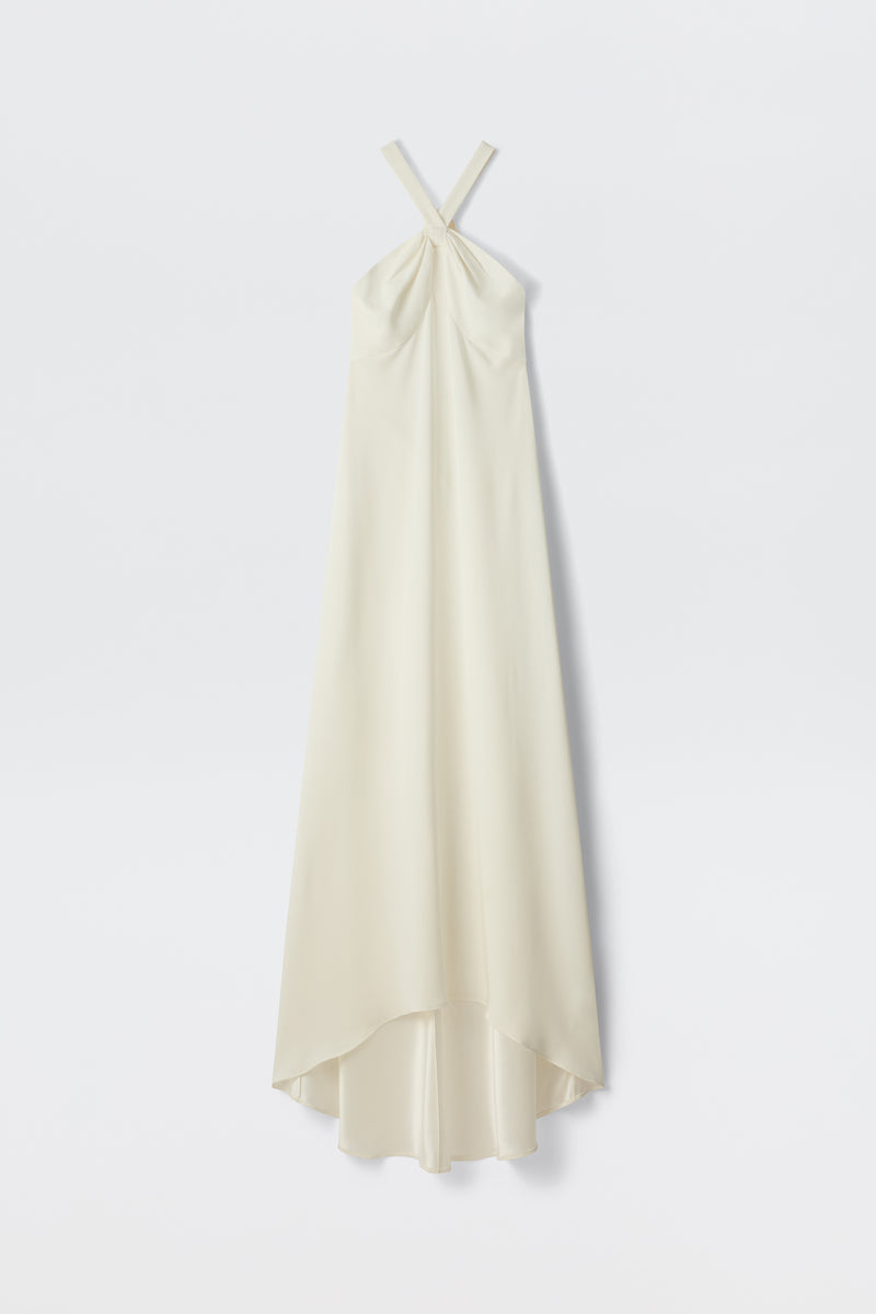 The Giorgia - Ivory is a long, sleeveless bridal gown in satin back crepe with a twist neck halter and high-low hem, shown against a plain white background.