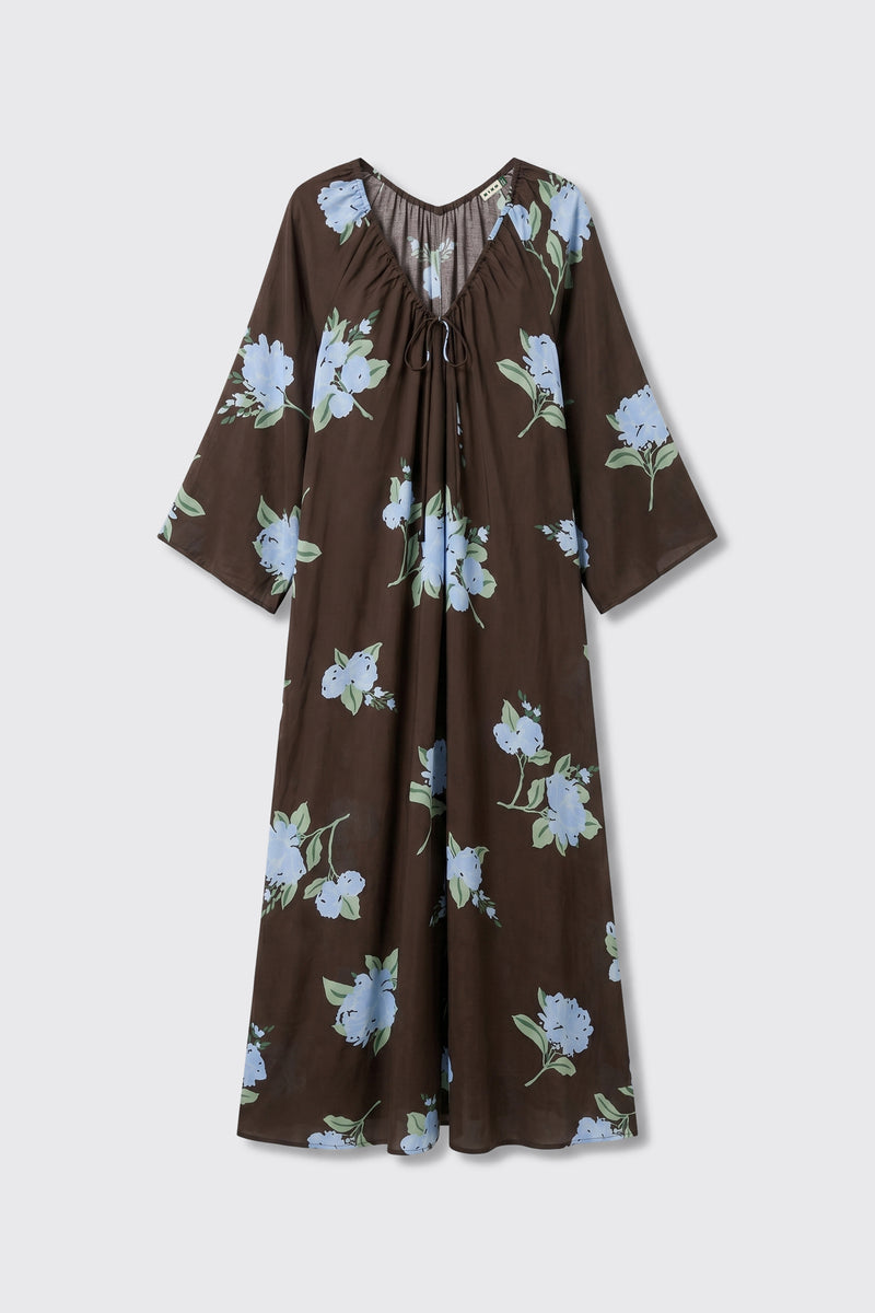 Lianne - Peonies Scatter Brown is a brown, long-sleeve, loose-fitting dress with a v-neck and drawstring, featuring a light blue and green peony floral pattern.