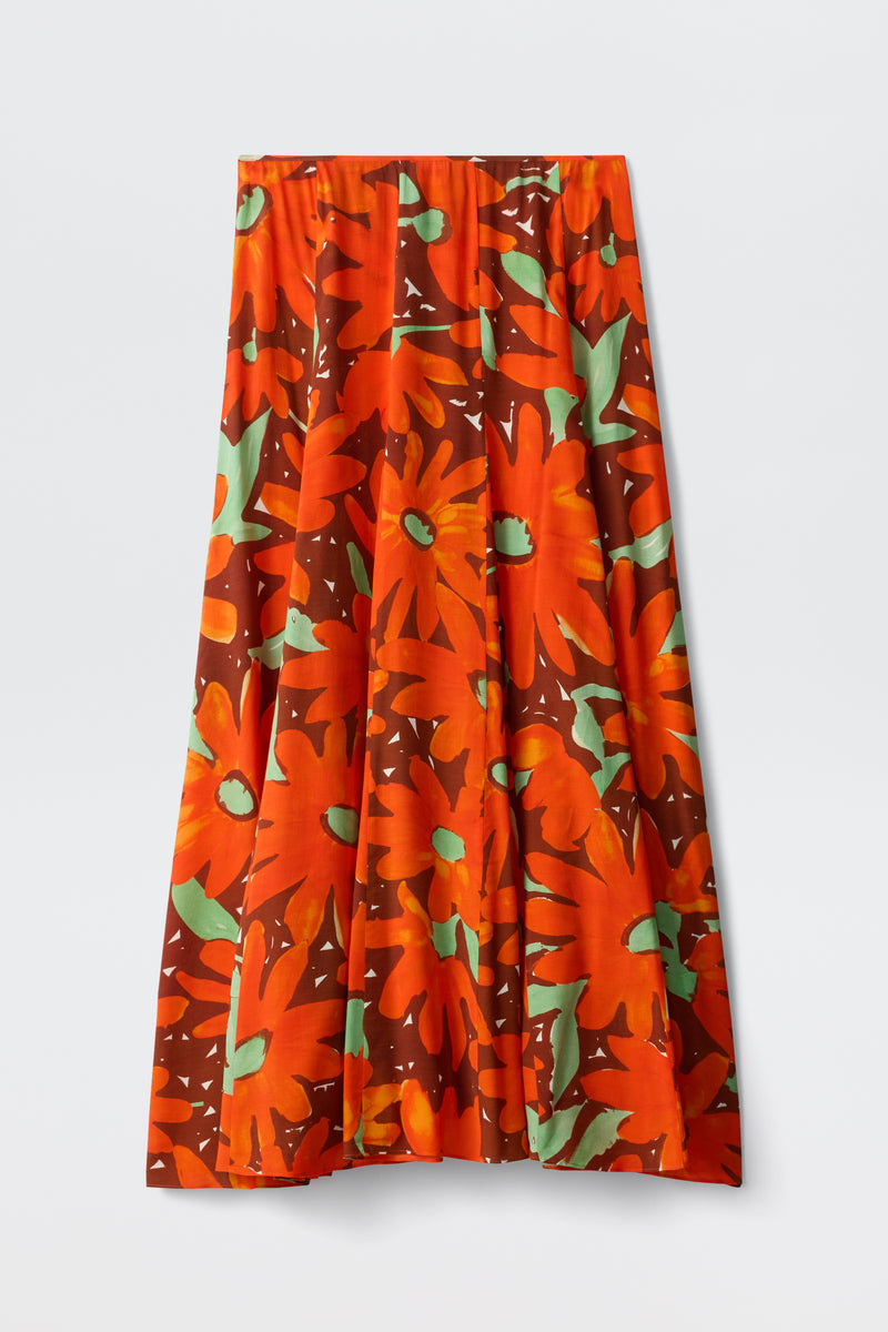 The Billy - Danish Floral Orange skirt features a bright, bold pattern of large orange and red flowers with green leaves on a dark background.