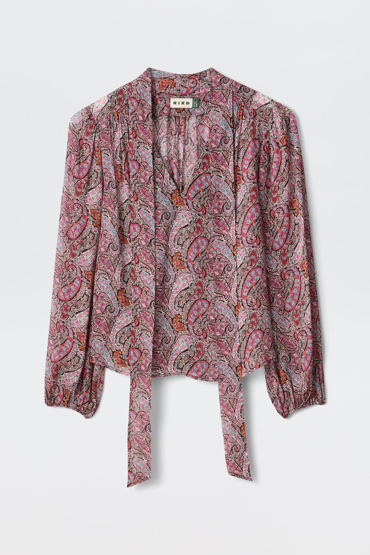 A long-sleeve Moss - Bourton Red georgette blouse with a pink, red, and purple paisley pattern, featuring a tie-front and slight gathering at the shoulders, displayed against a white background.