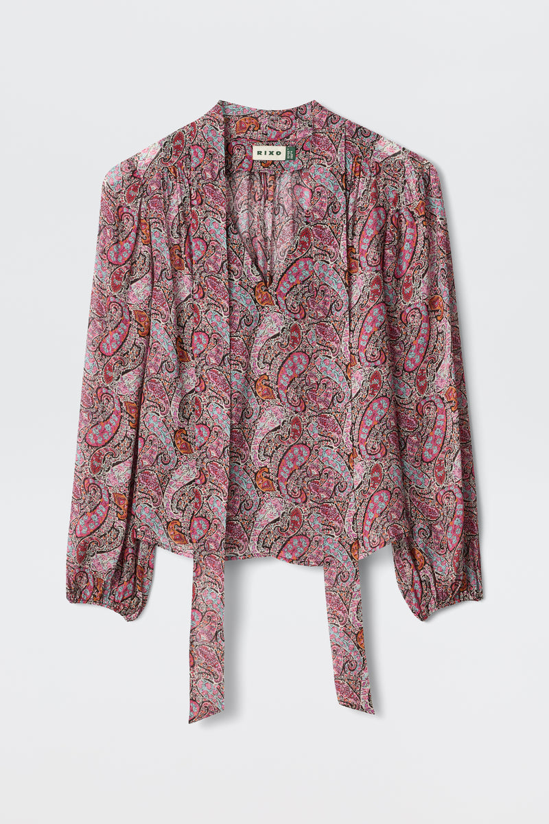 A long-sleeve Moss - Bourton Red georgette blouse with a pink, red, and purple paisley pattern, featuring a tie-front and slight gathering at the shoulders, displayed against a white background.