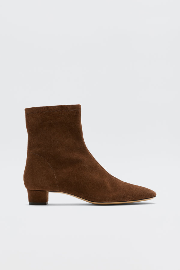 Rey - Chocolate: Feminine brown suede ankle boots with a low block heel and slightly pointed toe, shown on a plain white background.