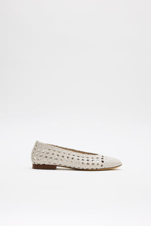 The Marlia - Cream is a light beige woven flat shoe featuring a perforated pattern and a small brown sole, shown against a plain white background.