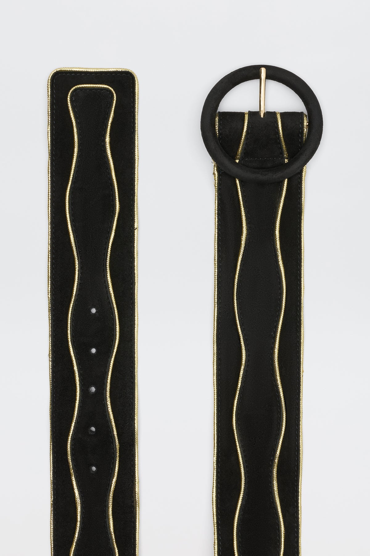 The Catalina - Black and Gold set features two sueded cow leather belts with braided-gold trim. One has a round black buckle; both include evenly spaced holes. They are shown on a simple white background.