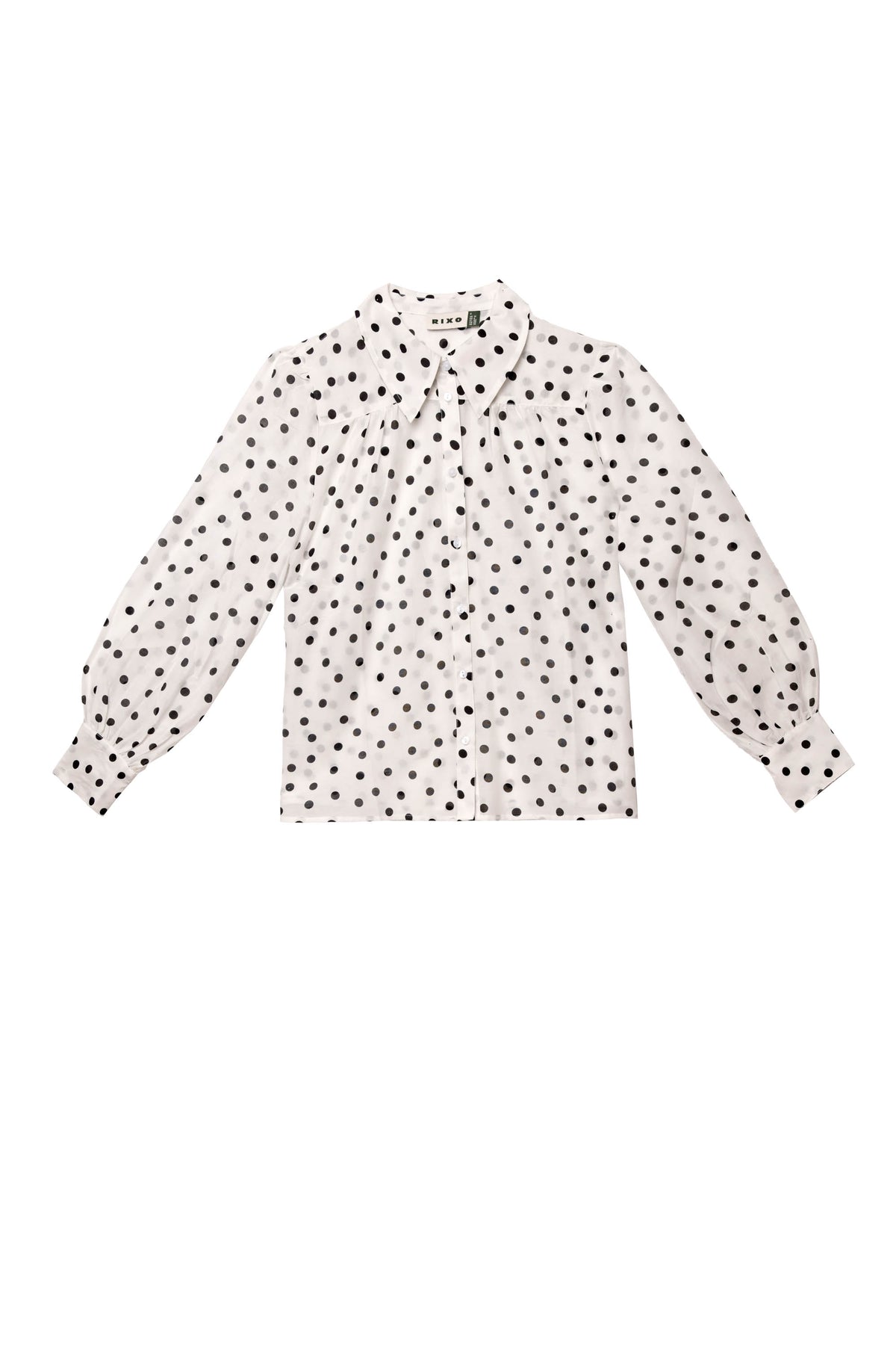Blake - Bohemia Spot Top: white cotton-voile long-sleeve shirt with black polka dots, exaggerated collar, button-up front, and cuffed sleeves shown laid flat on a white background.