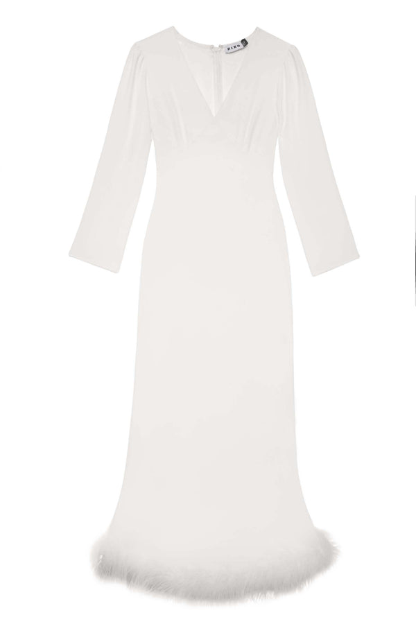 The Mya - Ivory Feathers is a floor-length, long-sleeved silk dress in white with a V-neckline and ivory feather-trimmed hem. Its fitted bodice and gently flared skirt offer a timeless silhouette, ideal for bridal occasions.