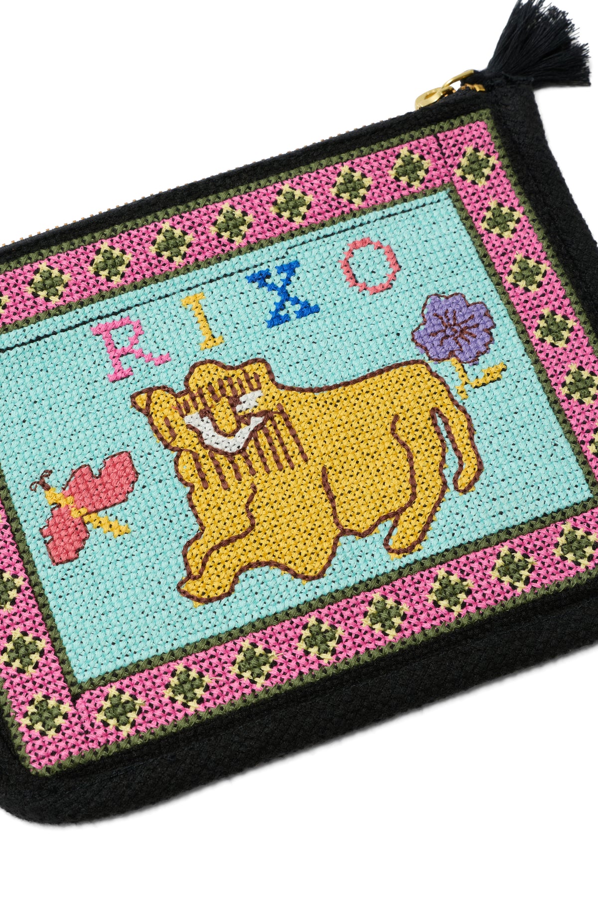 The Reiko - Mini Leo Cross Stitch Embroidery Charcoal is a colorful embroidered pouch featuring a yellow lion, a purple flower, a pink insect, and the word "RIZO" on a blue background with a pink and green floral border and finished with a black tassel.