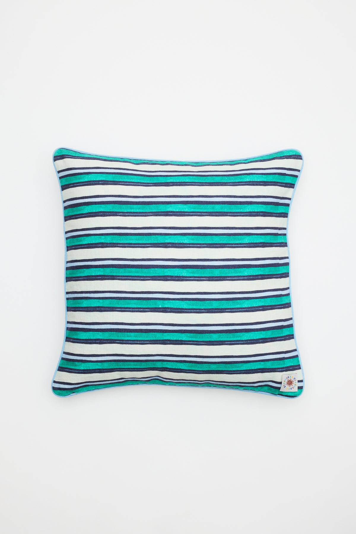 The Romilly - Cover Mythos Mix Navy is a rectangular pillow cover featuring horizontal stripes in blue, teal, and white on a plain white background, finished with a small corner tag.